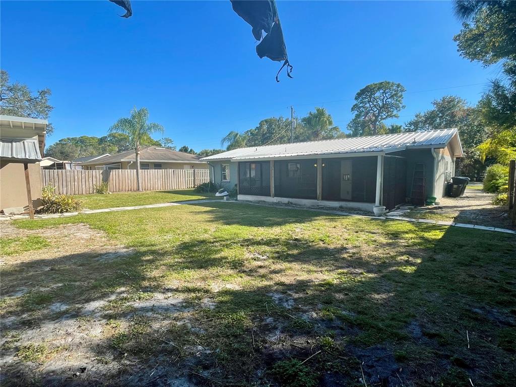 2043 Cordes Street Osprey, FL 34229 - Photo 30 of 35 a swimming pool with outdoor seating and yard