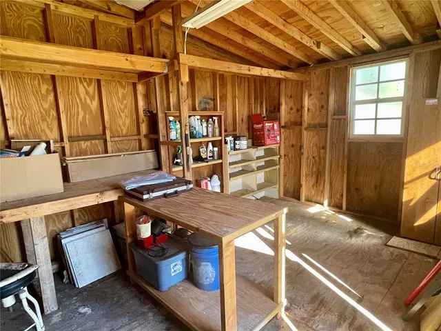 a kitchen that has a lot of cabinets in it
