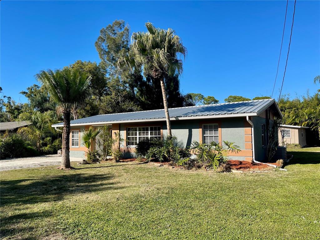 2043 Cordes Street Osprey, FL 34229 - Photo 35 of 35 a front view of a house with garden