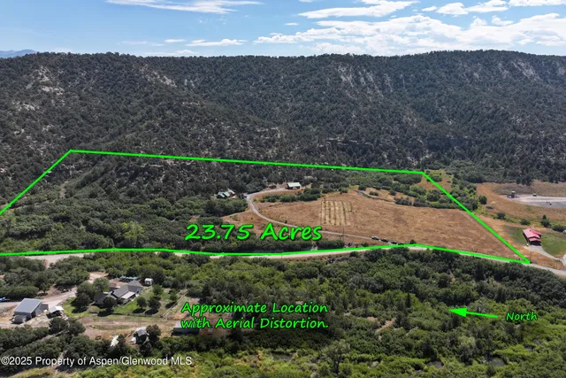 a view of a street with a mountain