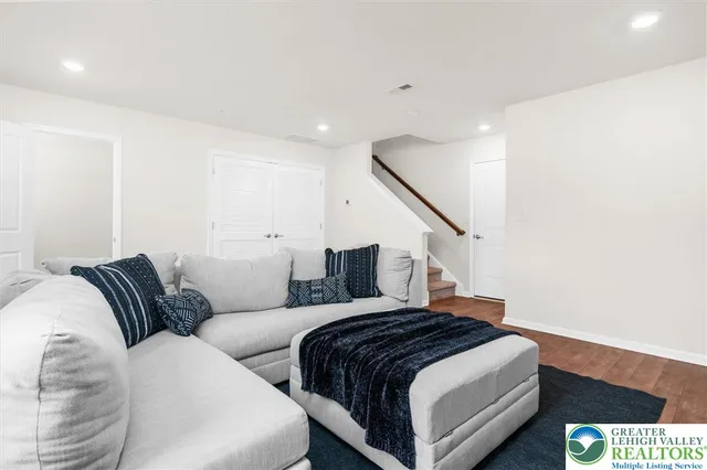 a bedroom with a bed and a couch