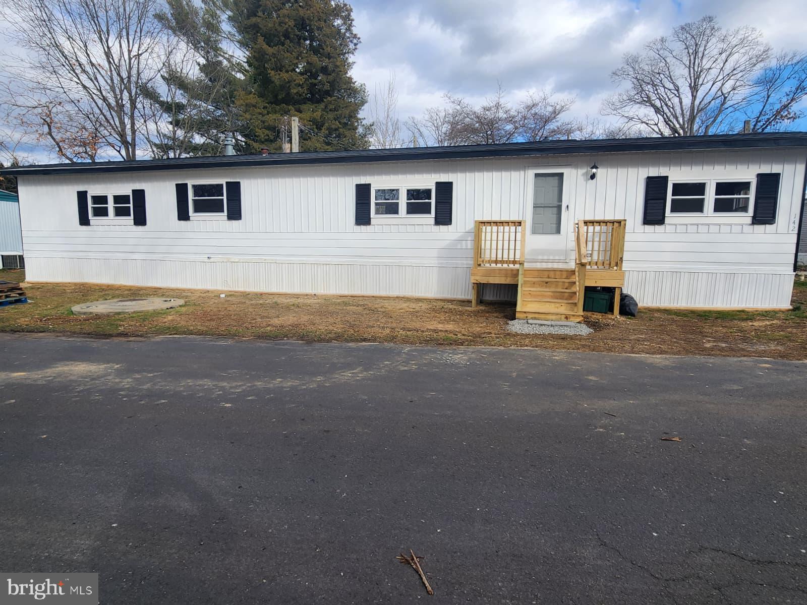 a house with yard in front of it