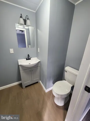 a kitchen with stainless steel appliances a stove a microwave a sink and cabinets