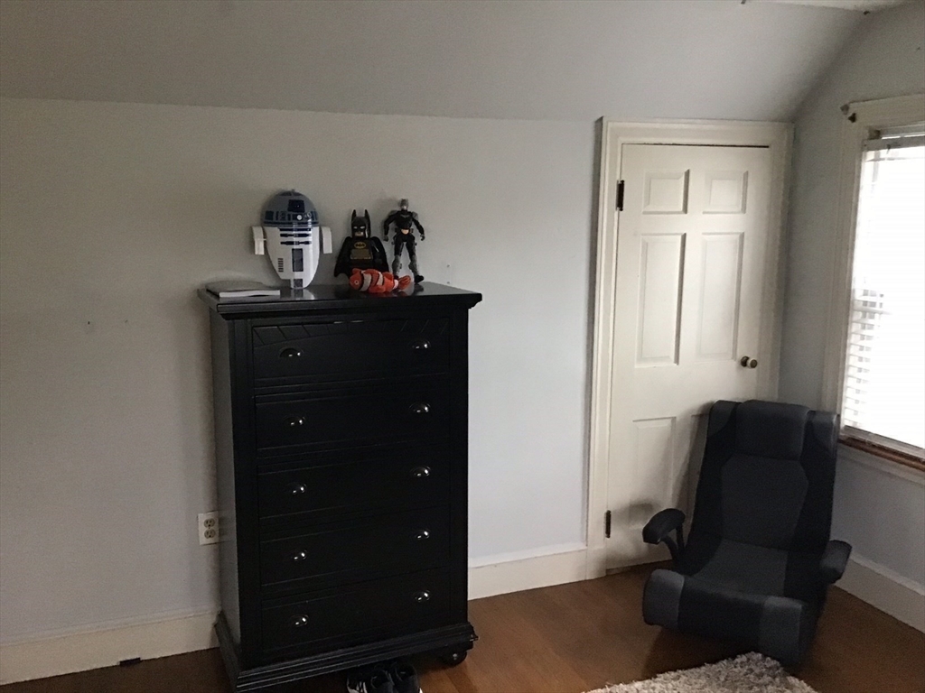 2 Coolidge Road Woburn, MA 01801 - Photo 11 of 24 a living room with furniture and a dresser