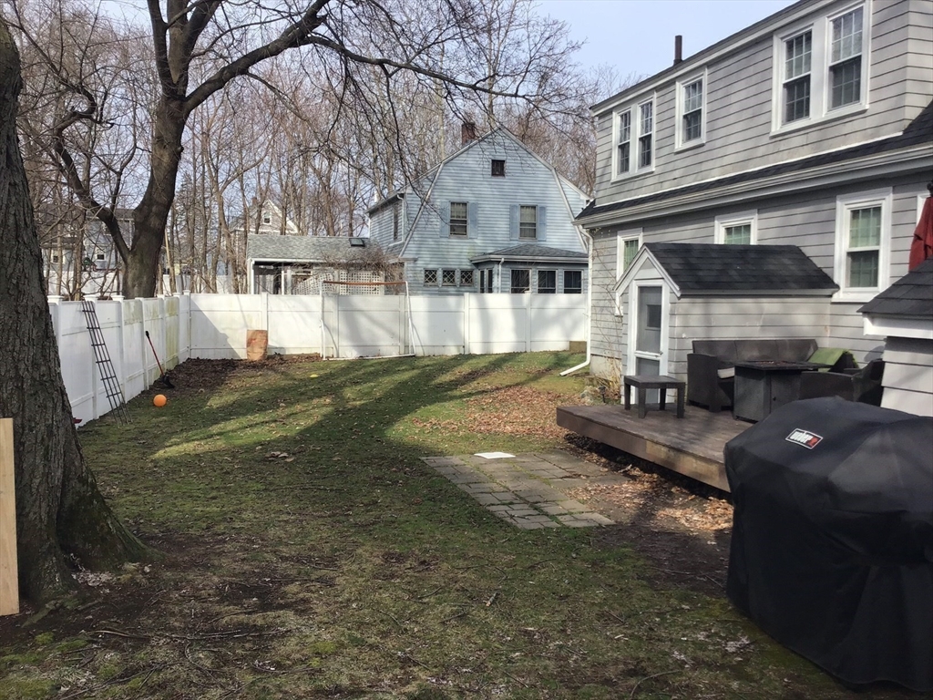 2 Coolidge Road Woburn, MA 01801 - Photo 20 of 24 a view of a house with a yard