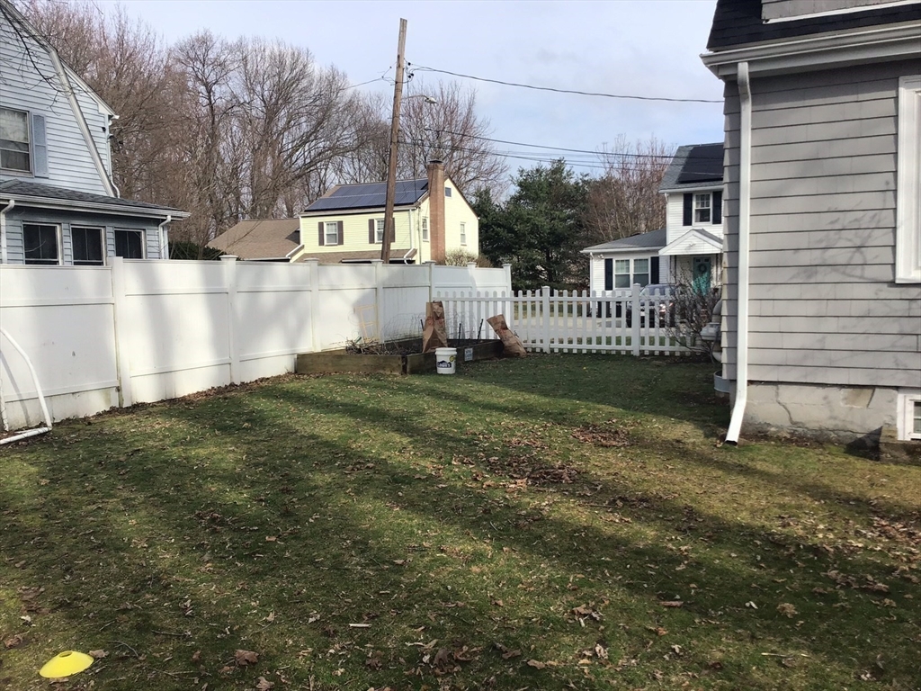 2 Coolidge Road Woburn, MA 01801 - Photo 21 of 24 a view of a house with a yard