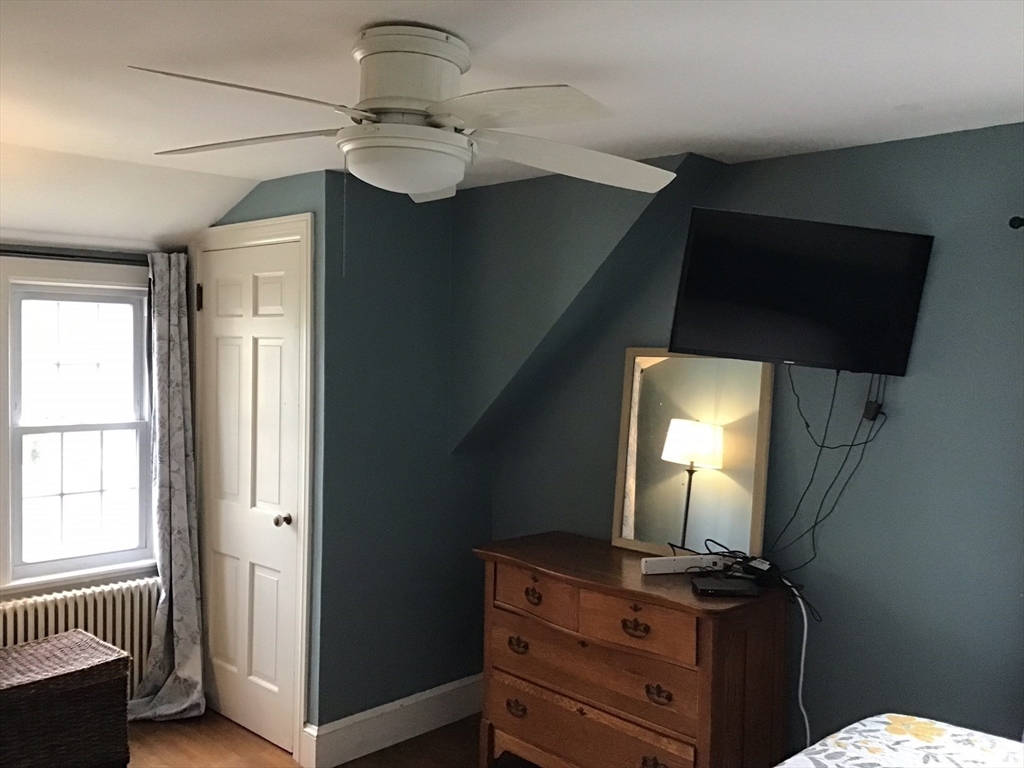 2 Coolidge Road Woburn, MA 01801 - Photo 8 of 24 a bathroom with a sink a mirror and a toilet