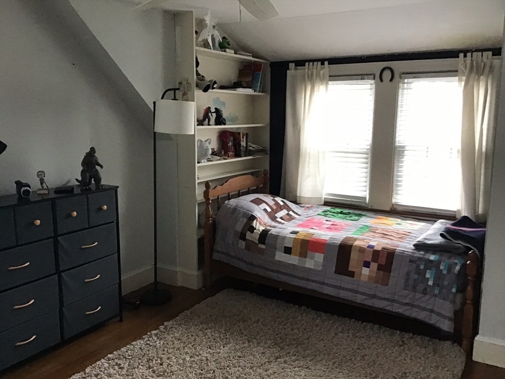 2 Coolidge Road Woburn, MA 01801 - Photo 10 of 24 a bedroom with bed and window