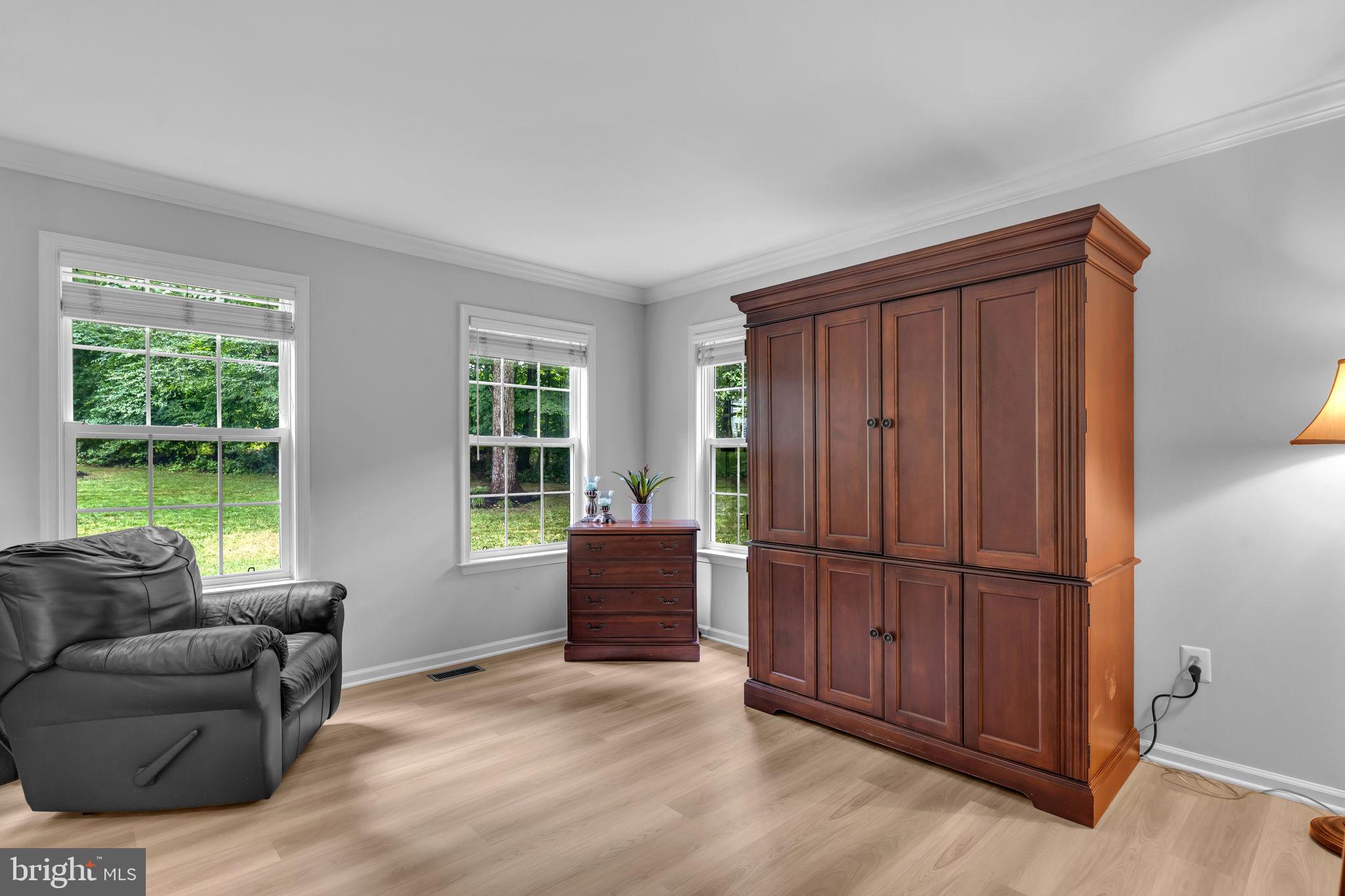 204 Walnut Creek Road Huntingtown, MD 20639 - Photo 19 of 59 a living room with furniture and windows