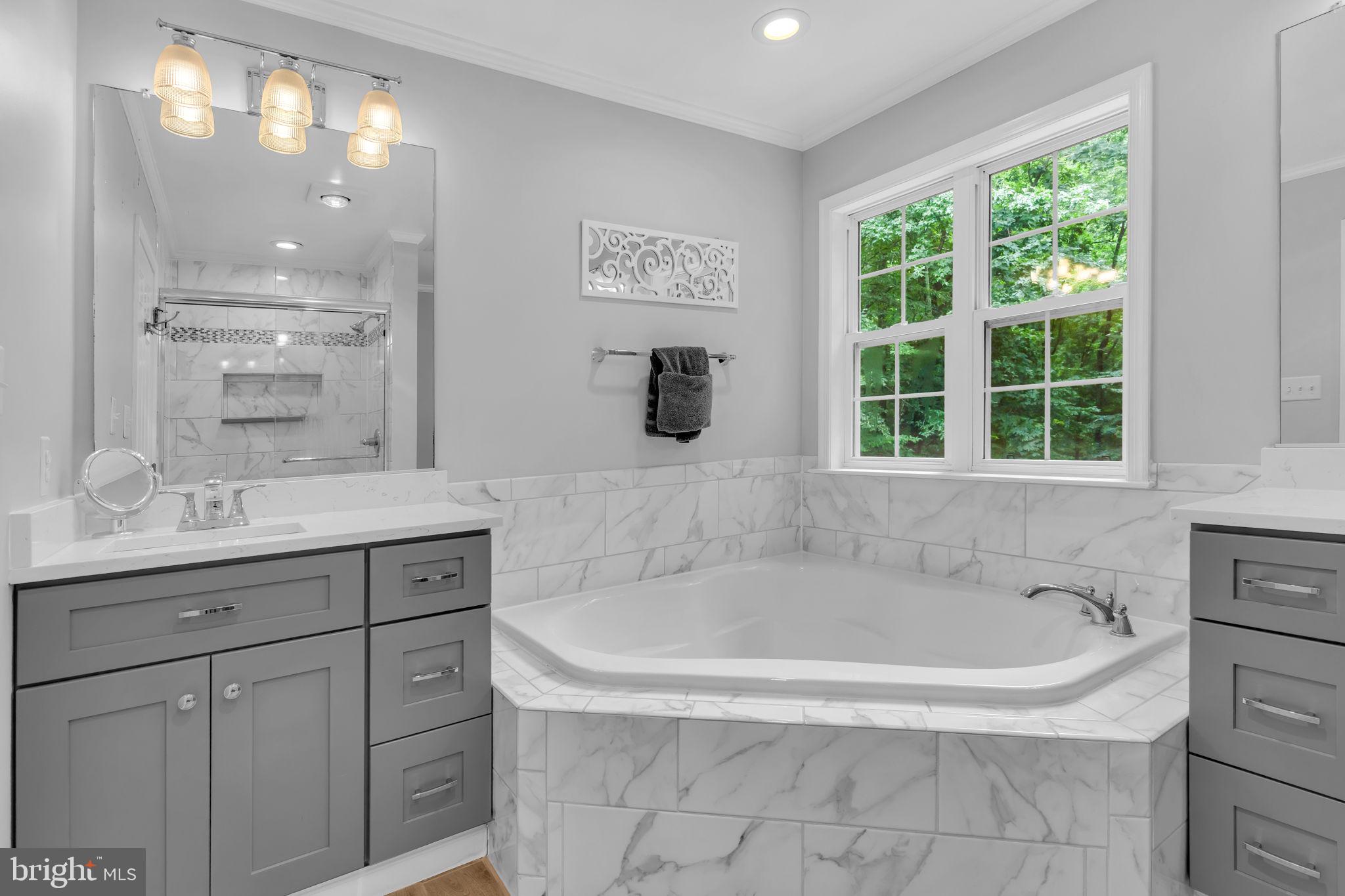 204 Walnut Creek Road Huntingtown, MD 20639 - Photo 27 of 59 a bathroom with a bathtub and a sink