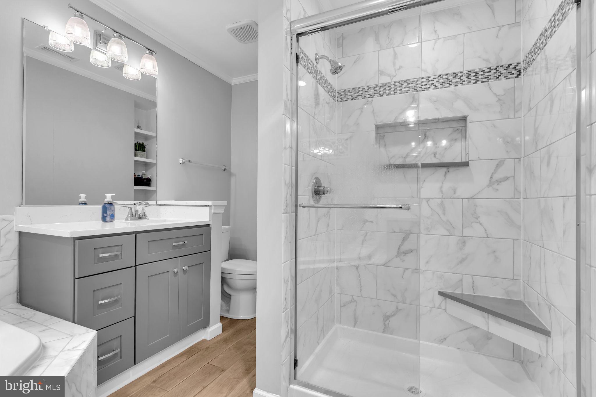204 Walnut Creek Road Huntingtown, MD 20639 - Photo 29 of 59 a bathroom with a double vanity sink mirror and shower