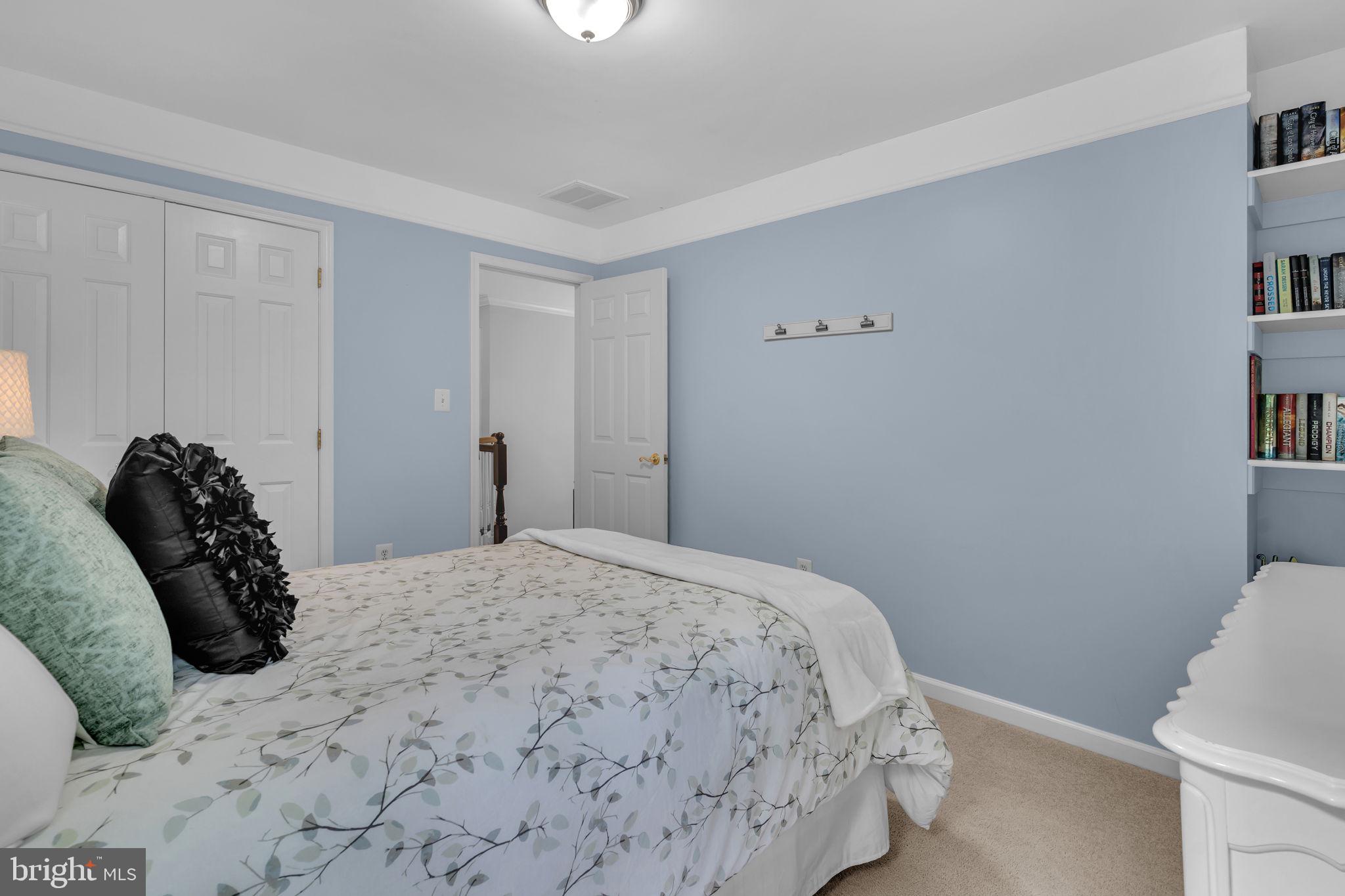 204 Walnut Creek Road Huntingtown, MD 20639 - Photo 33 of 59 a bedroom with a bed and a window