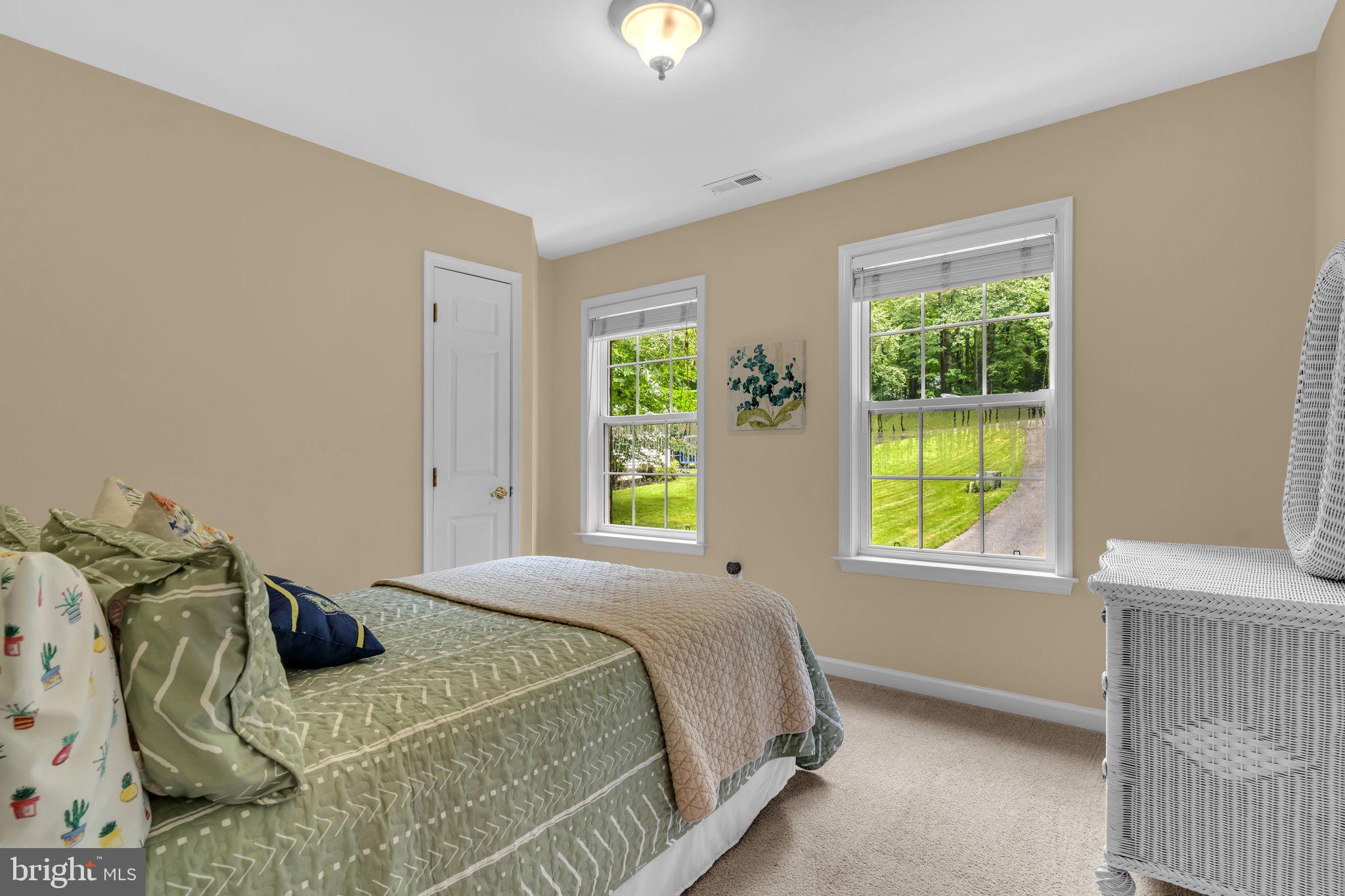 204 Walnut Creek Road Huntingtown, MD 20639 - Photo 34 of 59 a bedroom with a bed and a window