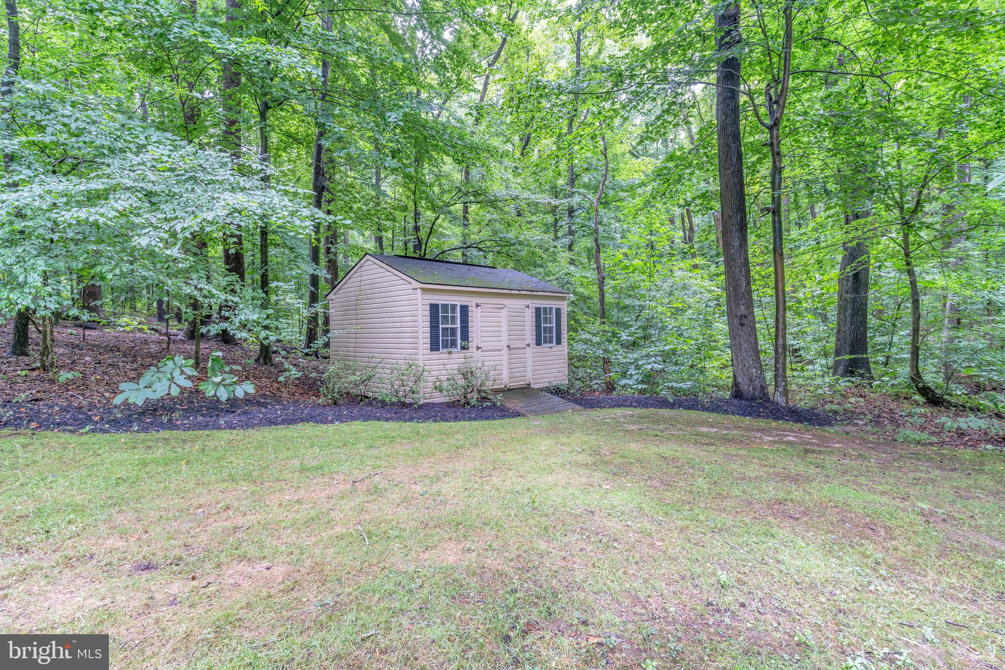 204 Walnut Creek Road Huntingtown, MD 20639 - Photo 45 of 59 a view of a house with backyard and garden