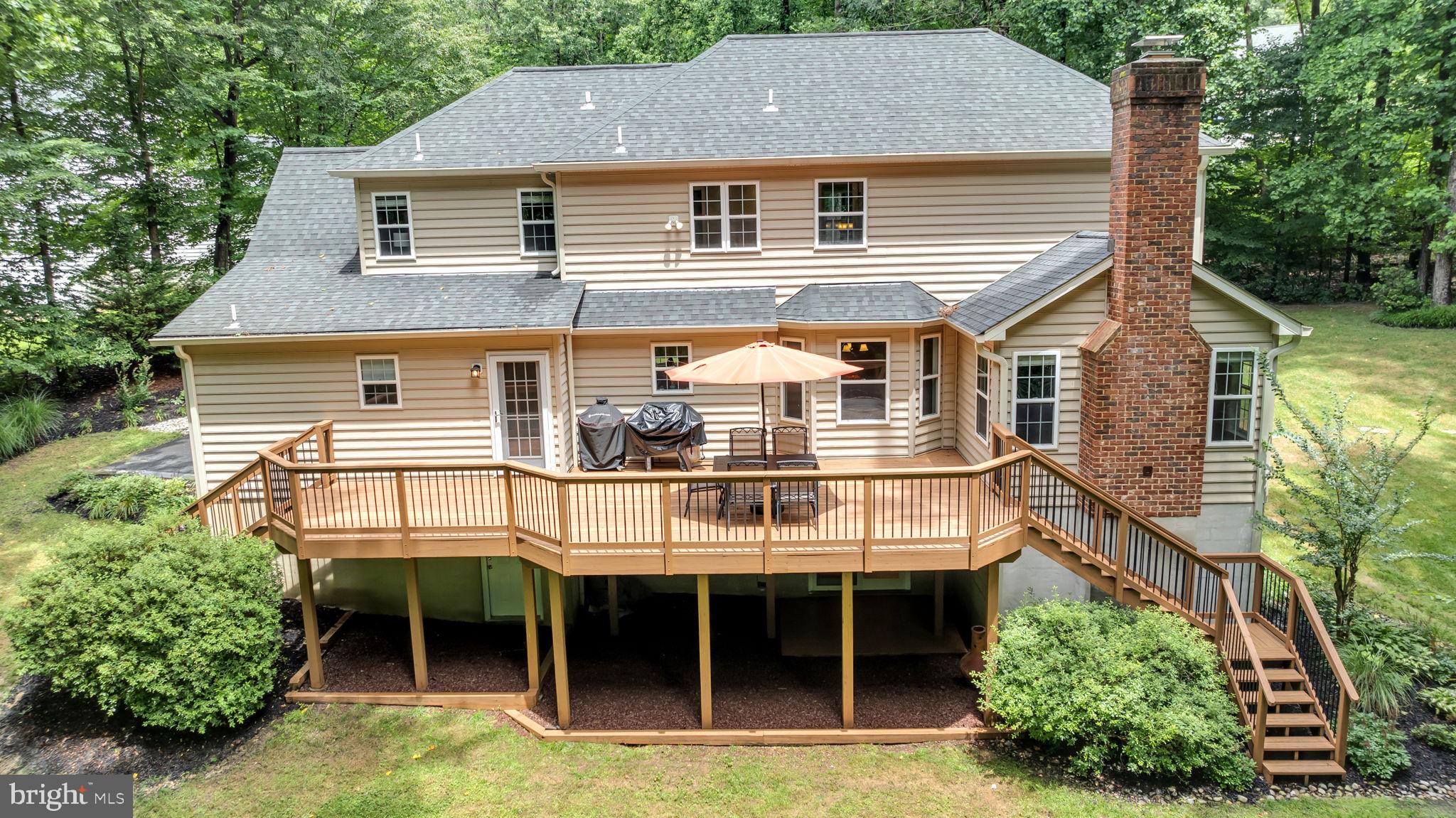 204 Walnut Creek Road Huntingtown, MD 20639 - Photo 47 of 59 a aerial view of a house with a yard and potted plants