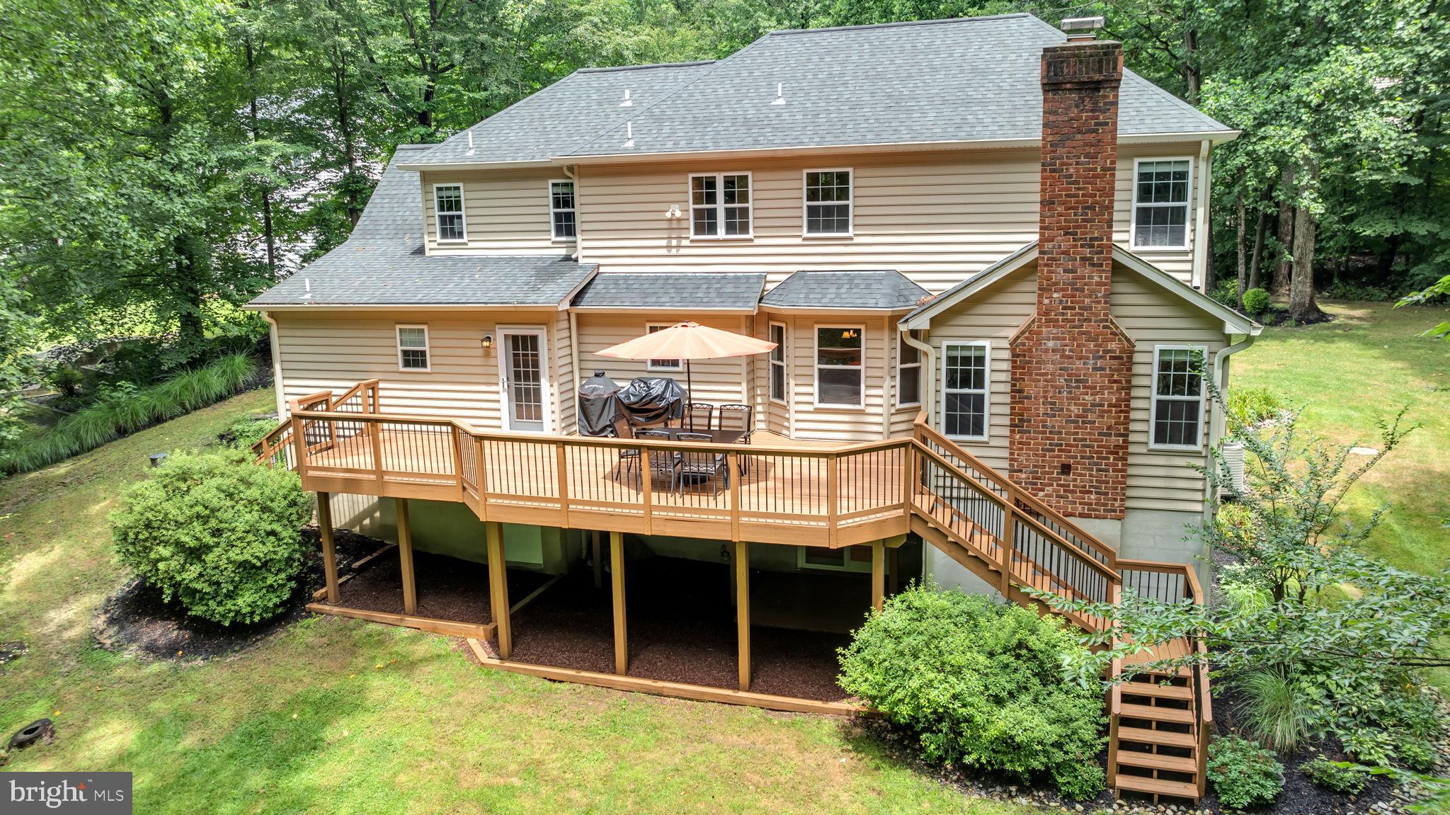 204 Walnut Creek Road Huntingtown, MD 20639 - Photo 5 of 59 a view of a house with a window and potted plants
