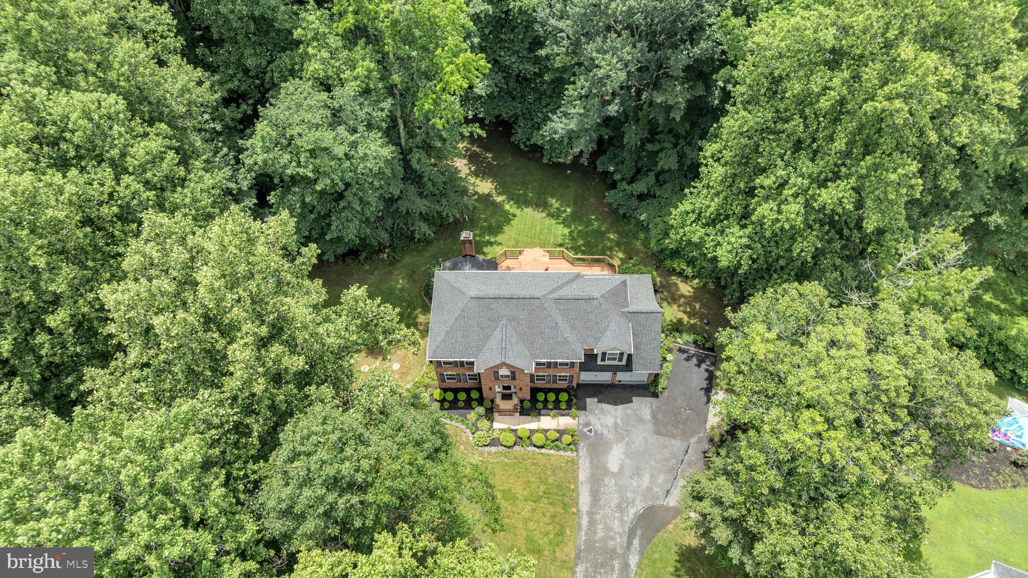 204 Walnut Creek Road Huntingtown, MD 20639 - Photo 51 of 59 an aerial view of a house with a garden