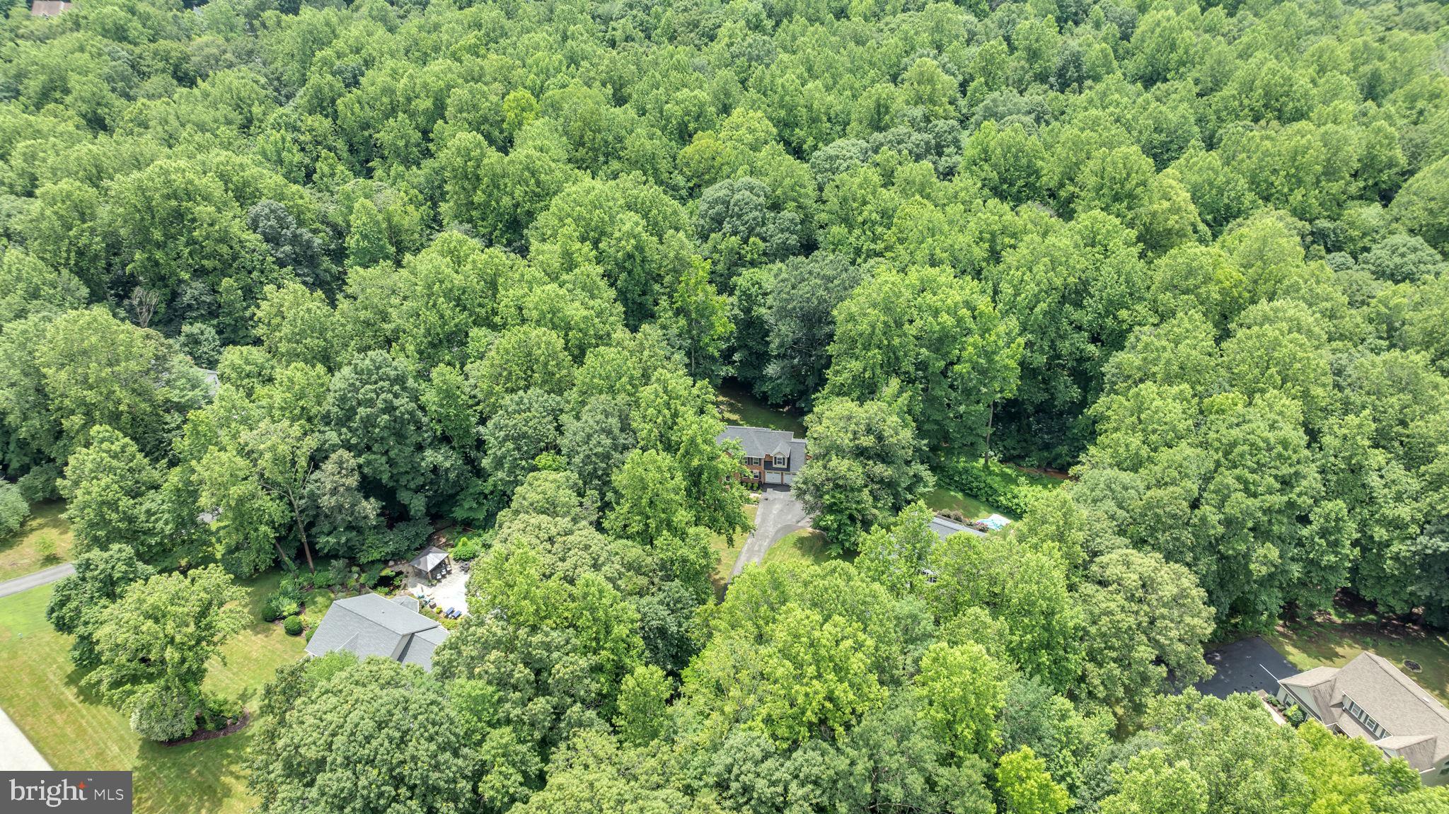 204 Walnut Creek Road Huntingtown, MD 20639 - Photo 56 of 59 an aerial view of residential house with outdoor space and trees all around