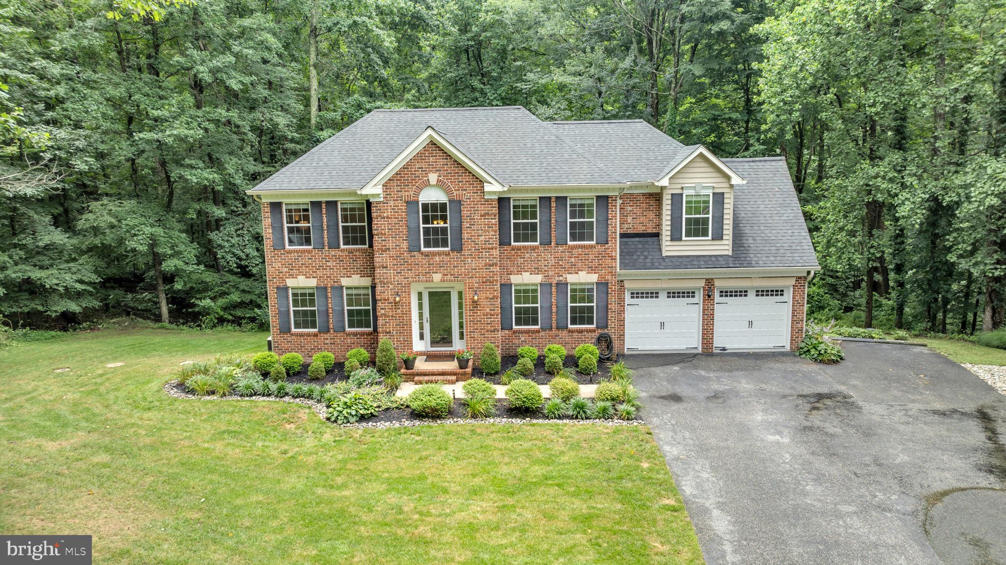 204 Walnut Creek Road Huntingtown, MD 20639 - Photo 59 of 59 a front view of a house with a yard