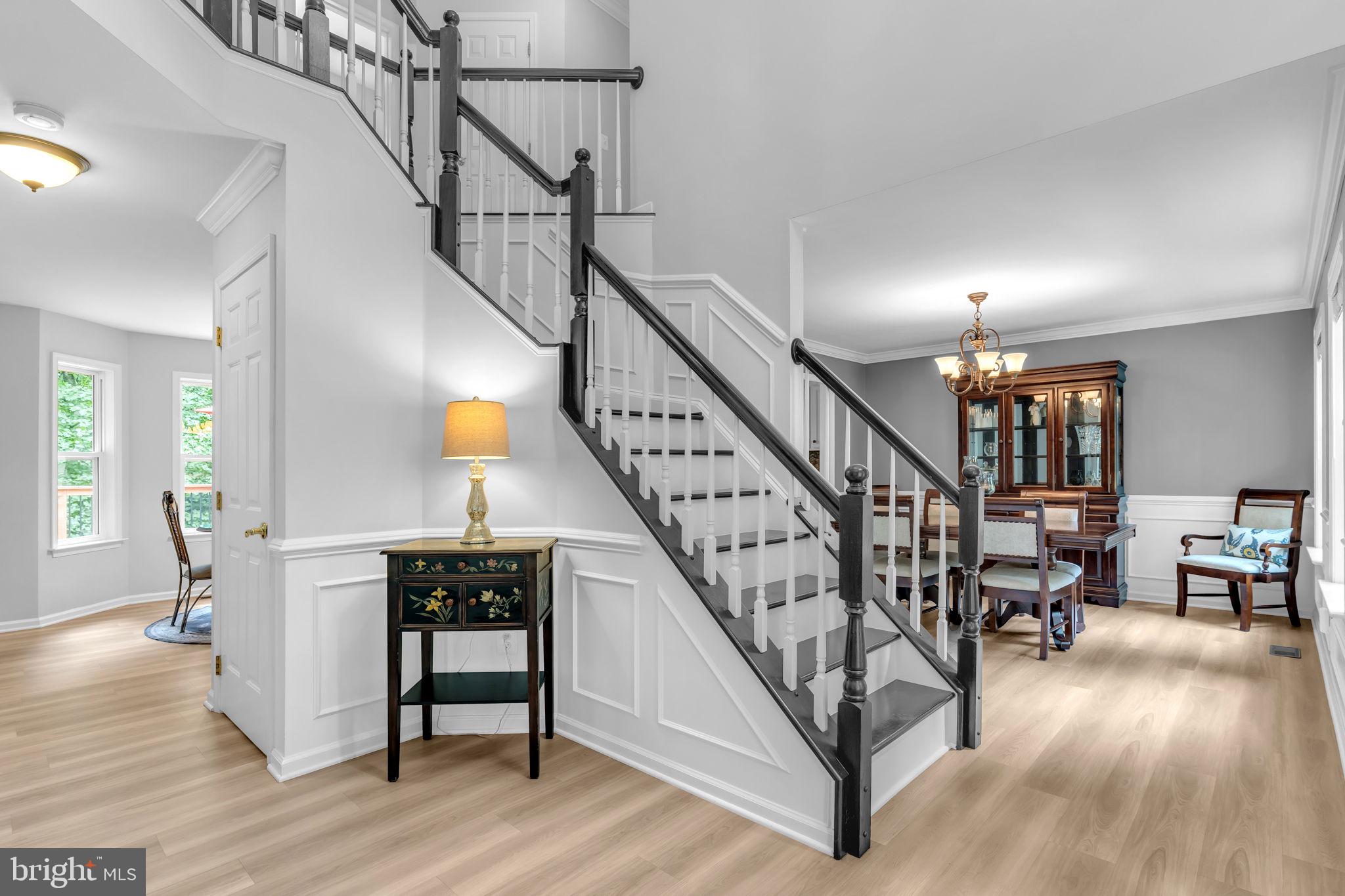 204 Walnut Creek Road Huntingtown, MD 20639 - Photo 7 of 59 a view of entryway dining room and hall with wooden floor
