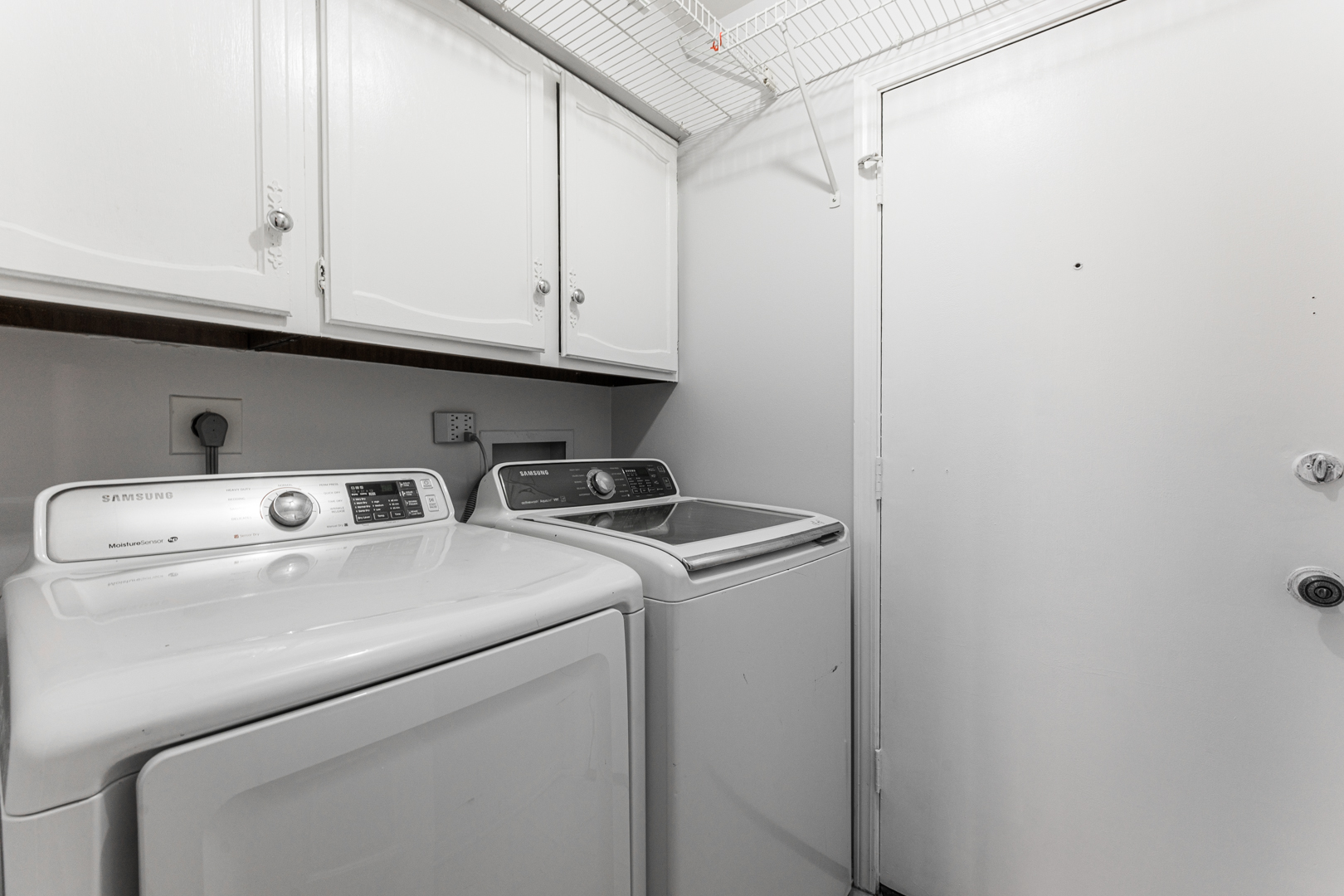 1831 Mission Hills Road, Unit 106 Northbrook, IL 60062 - Photo 24 of 37 a utility room with dryer and washer