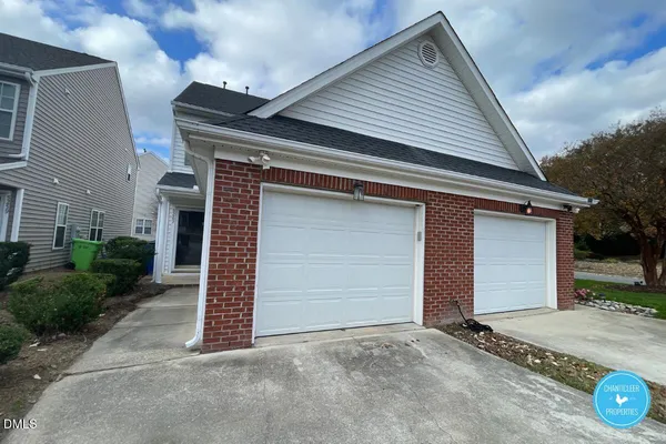 a front view of a house with a garage