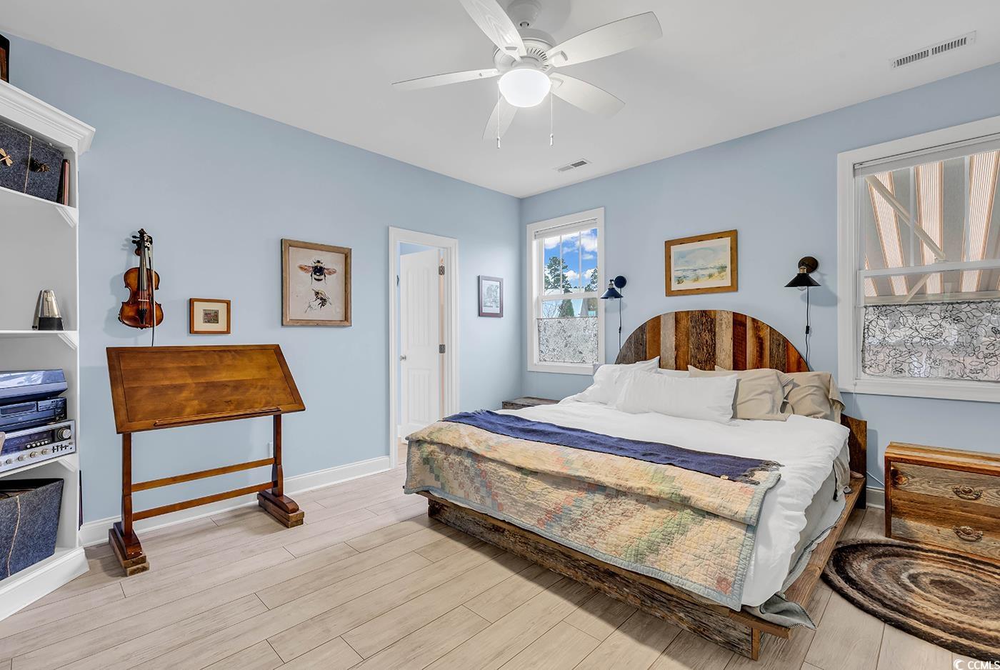 317 Goddard Lane Murrells Inlet, SC 29576 - Photo 16 of 40 Bedroom with ceiling fan and light hardwood / wood