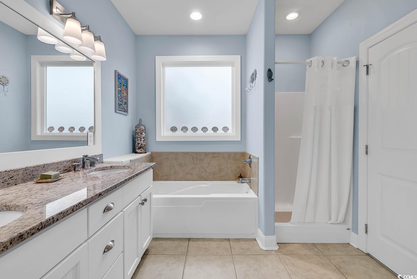 317 Goddard Lane Murrells Inlet, SC 29576 - Photo 17 of 40 Bathroom featuring a tub to relax in, tile pattern
