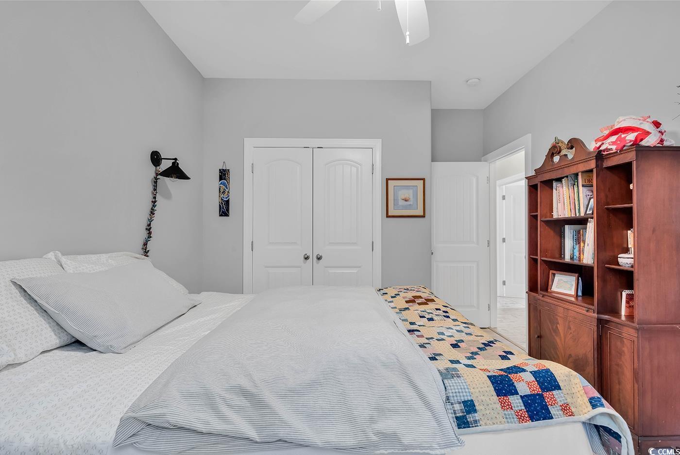 317 Goddard Lane Murrells Inlet, SC 29576 - Photo 22 of 40 Bedroom featuring ceiling fan and a closet
