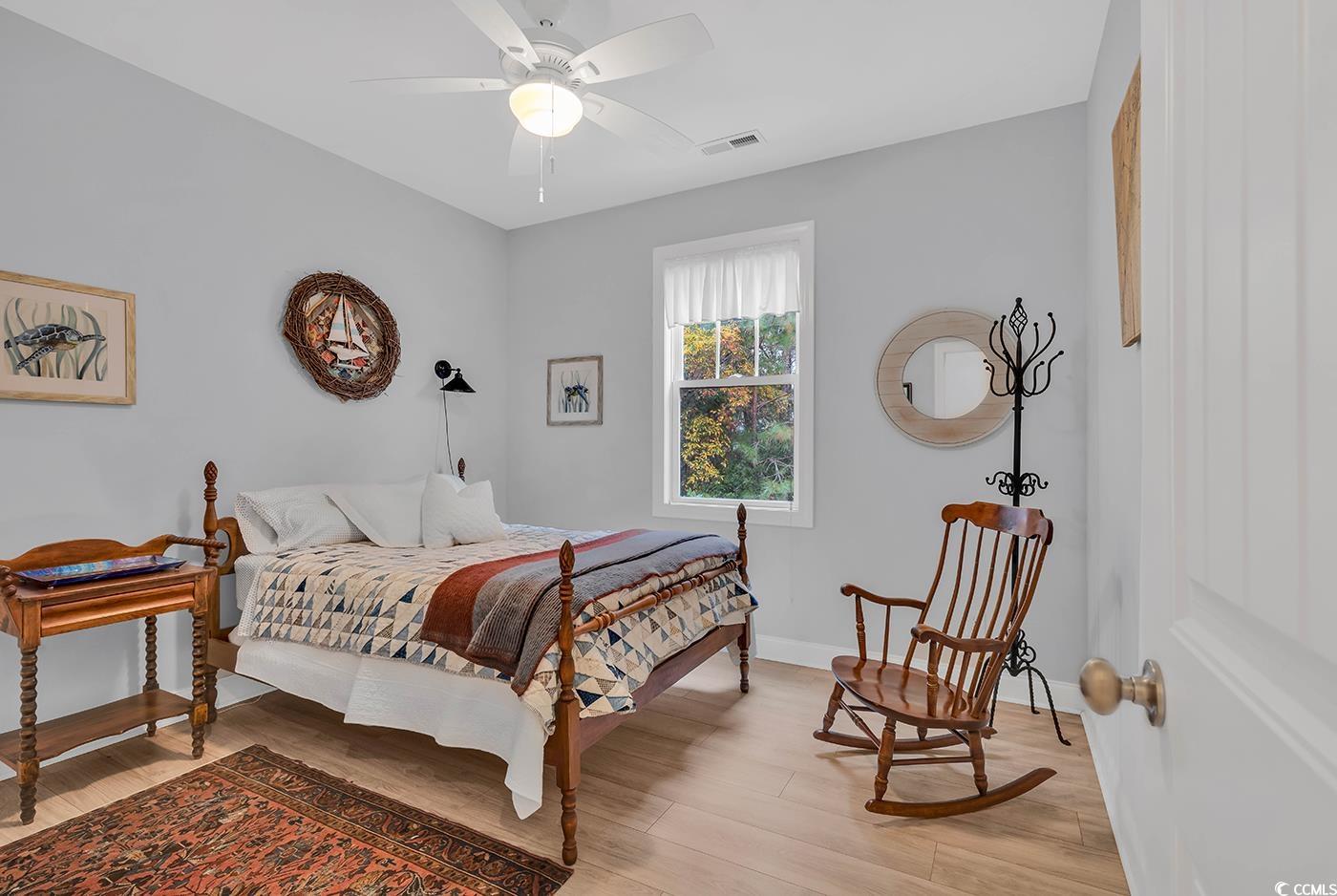 317 Goddard Lane Murrells Inlet, SC 29576 - Photo 25 of 40 Bedroom featuring ceiling fan and light hardwood /