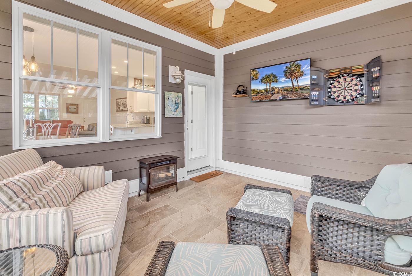 317 Goddard Lane Murrells Inlet, SC 29576 - Photo 29 of 40 Interior space with ceiling fan, wooden walls, and