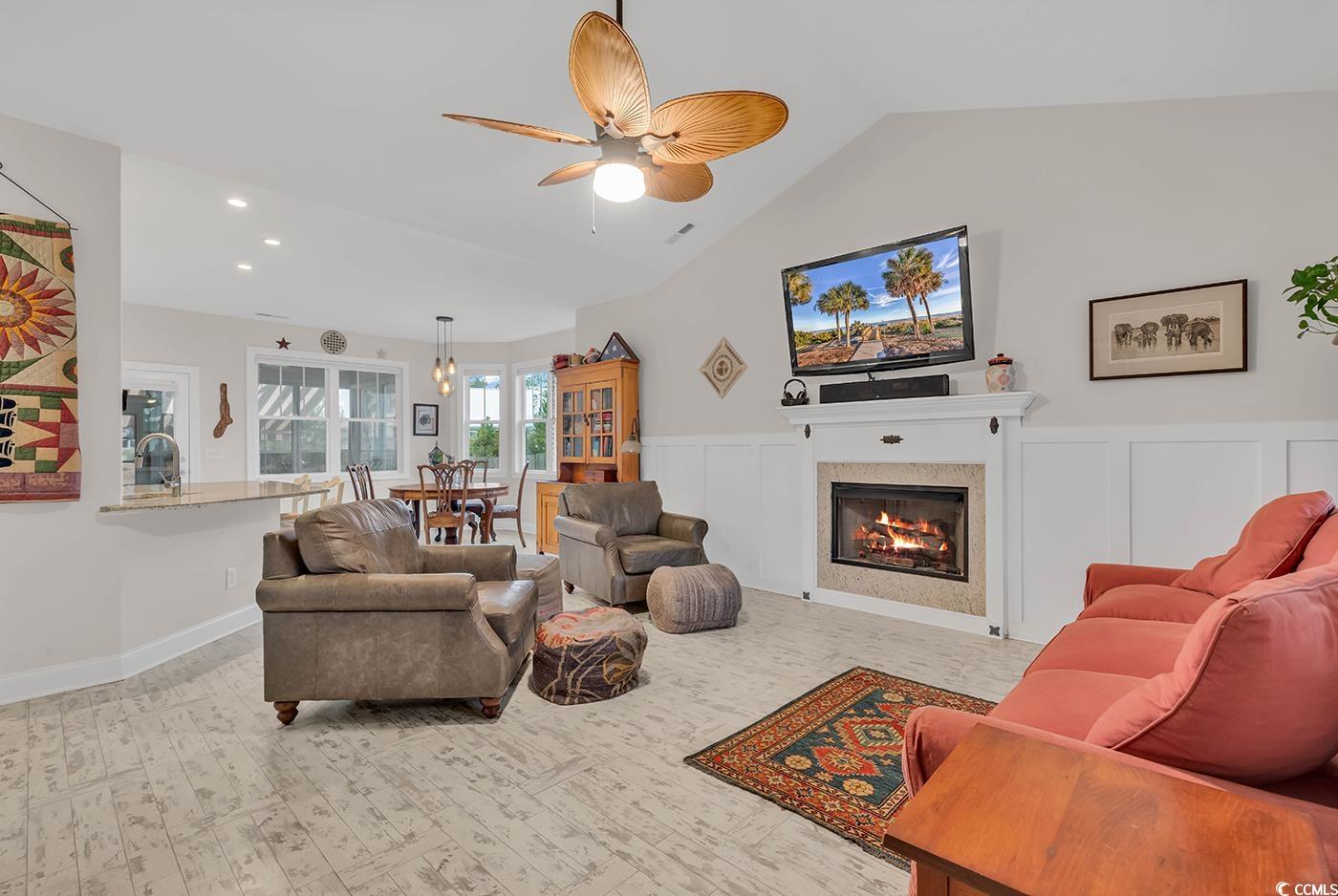317 Goddard Lane Murrells Inlet, SC 29576 - Photo 4 of 40 Living room with ceiling fan, a tiled fireplace, s
