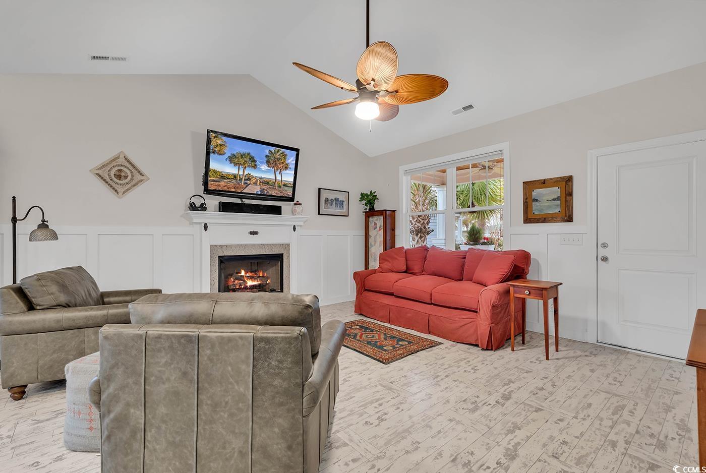 317 Goddard Lane Murrells Inlet, SC 29576 - Photo 5 of 40 Living room featuring a tile fireplace, ceiling fa