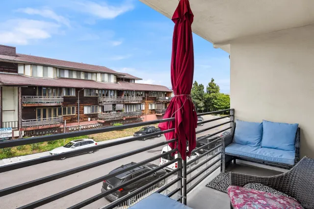 a view of a balcony with chairs