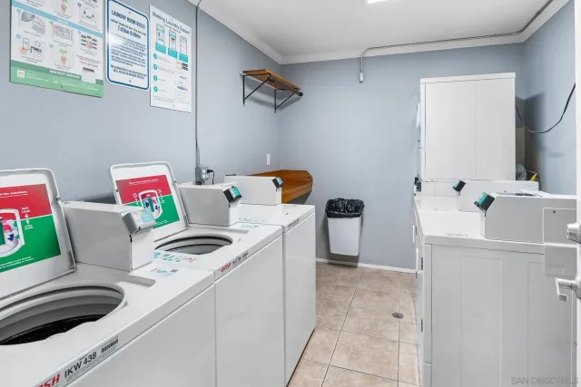 a room with a refrigerator and a sink