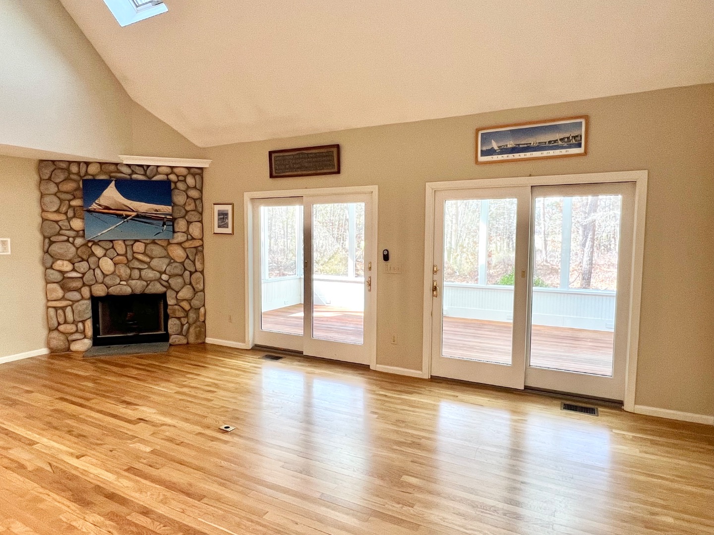 209 Cove Road Vineyard Haven, MA 02568 - Photo 17 of 81 a view of an empty room with wooden floor and a window