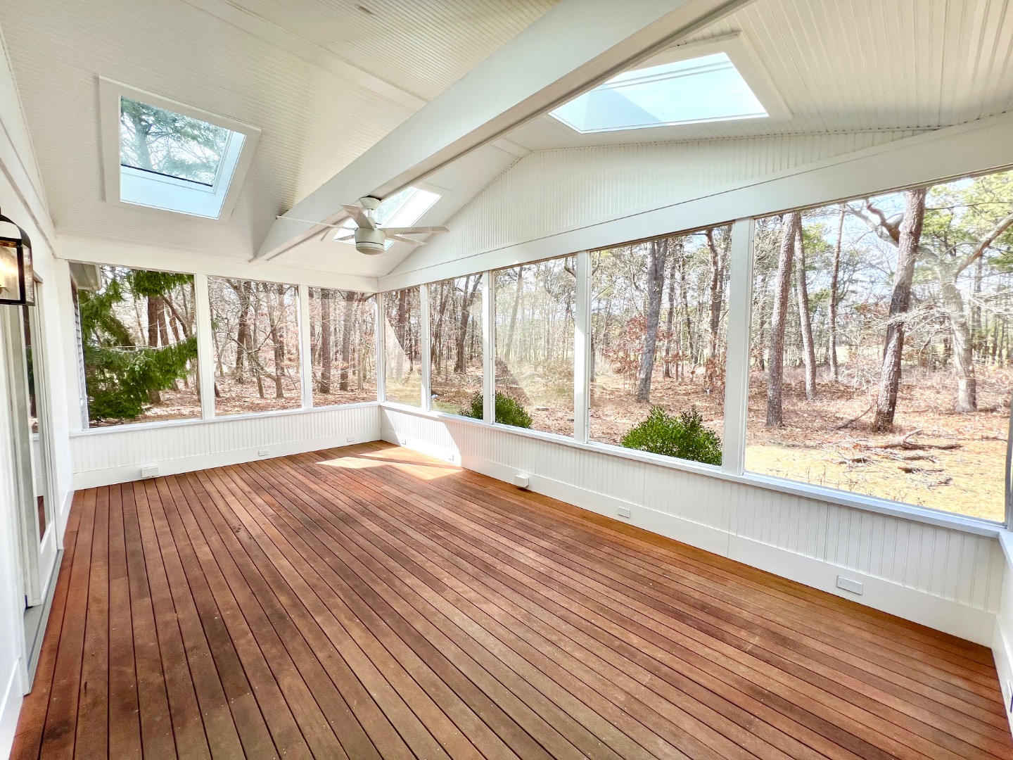 209 Cove Road Vineyard Haven, MA 02568 - Photo 18 of 81 a view of an empty room with wooden floor and a window