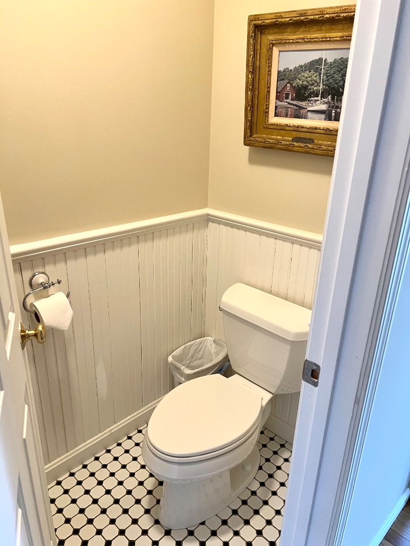 209 Cove Road Vineyard Haven, MA 02568 - Photo 29 of 81 a bathroom with a toilet and a shower curtain