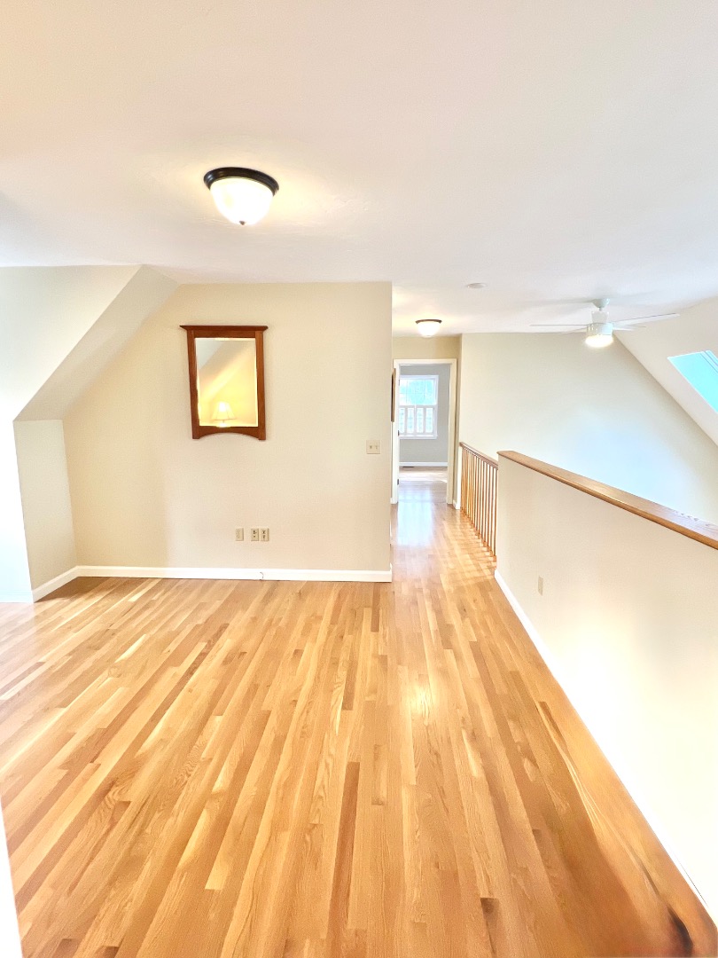 209 Cove Road Vineyard Haven, MA 02568 - Photo 39 of 81 a view of empty room with wooden floor