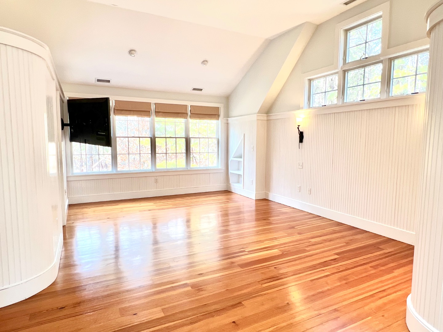 209 Cove Road Vineyard Haven, MA 02568 - Photo 44 of 81 a view of an empty room with wooden floor and a window