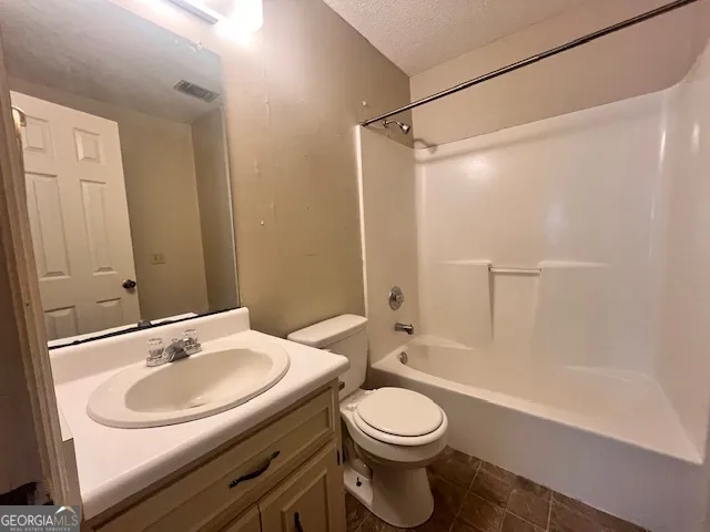 a bathroom with a sink a toilet and a bathtub