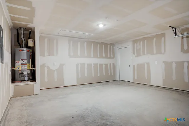 a kitchen with granite countertop a sink and a stove top oven with wooden floor