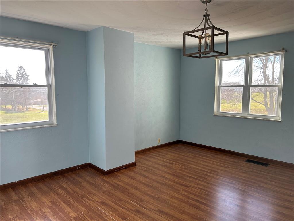 556 Bonniebrook Road Butler, PA 16002 - Photo 12 of 36 a view of an empty room with wooden floor and a window