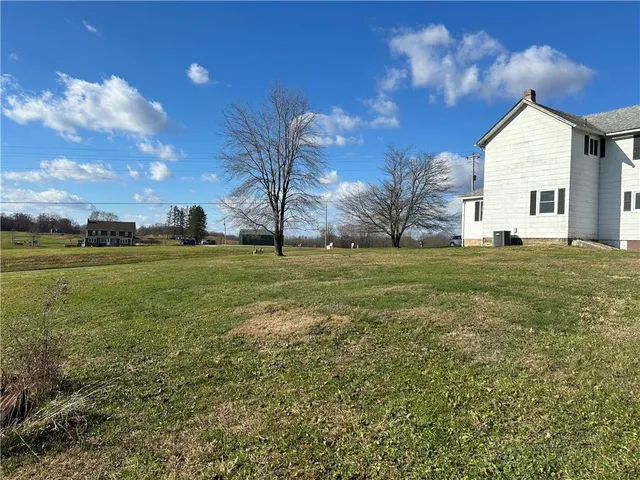 a view of a house with a big yard