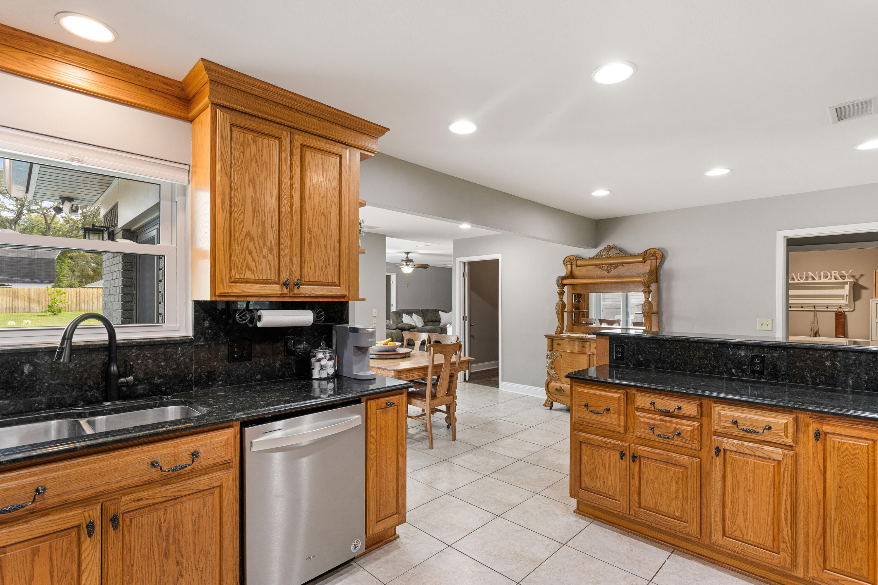 804 Mars Street Destin, FL 32541 - Photo 11 of 71 a kitchen with stainless steel appliances granite countertop a stove a sink and a granite counter tops