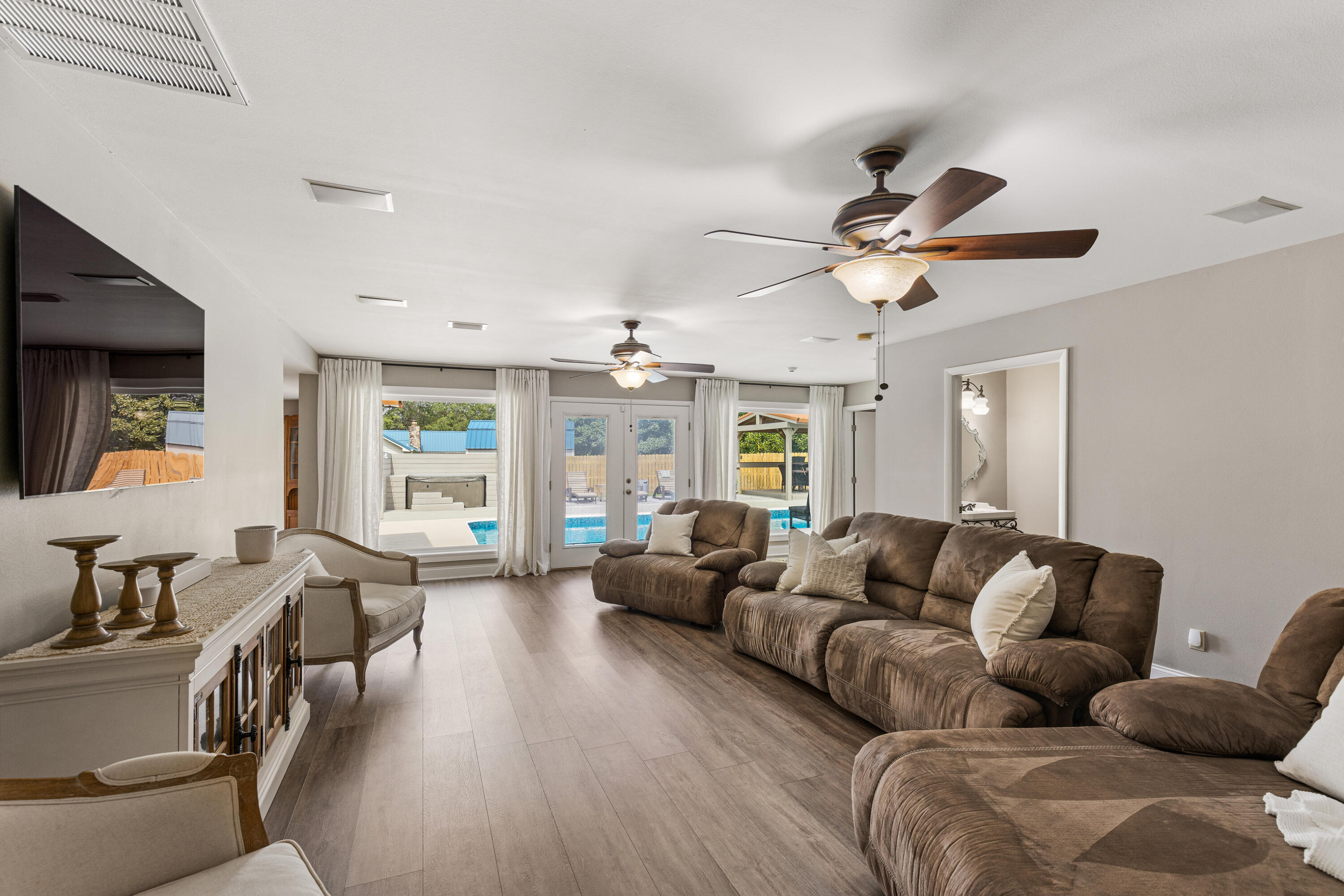 804 Mars Street Destin, FL 32541 - Photo 14 of 71 a living room with furniture ceiling fan and a large window