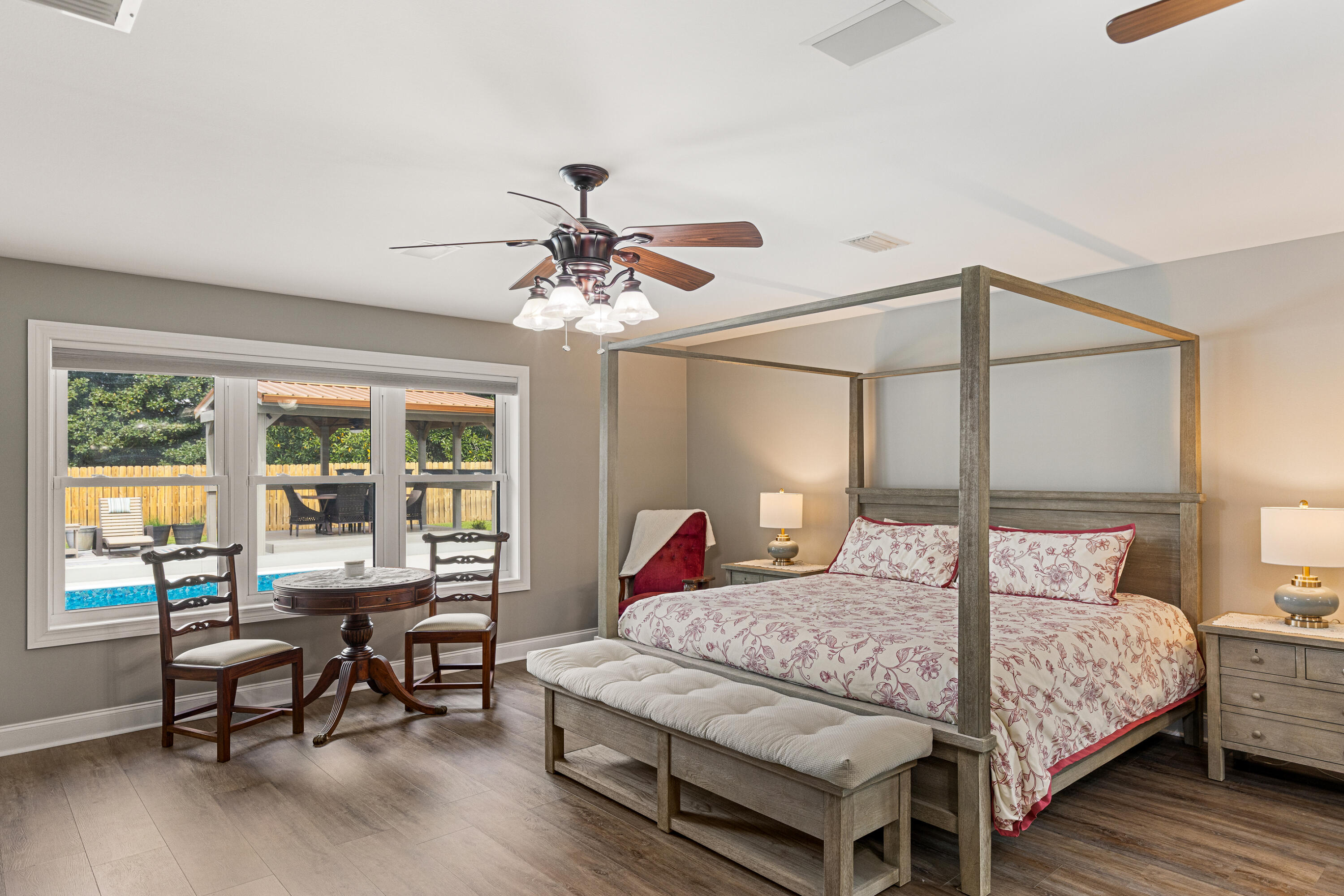 804 Mars Street Destin, FL 32541 - Photo 18 of 71 a bedroom with a bed a table and chair