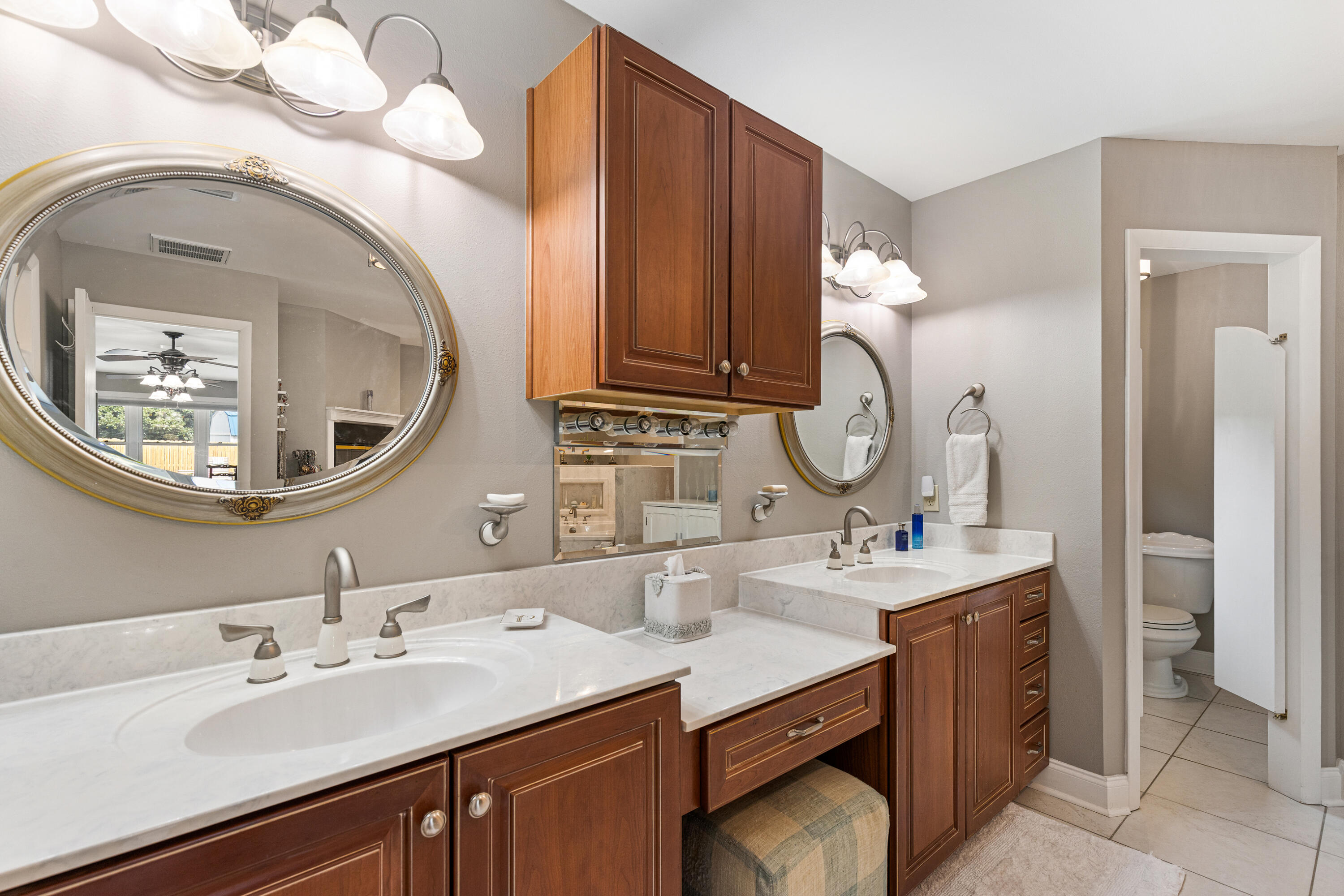 804 Mars Street Destin, FL 32541 - Photo 21 of 71 a bathroom with a double vanity sink and a mirror