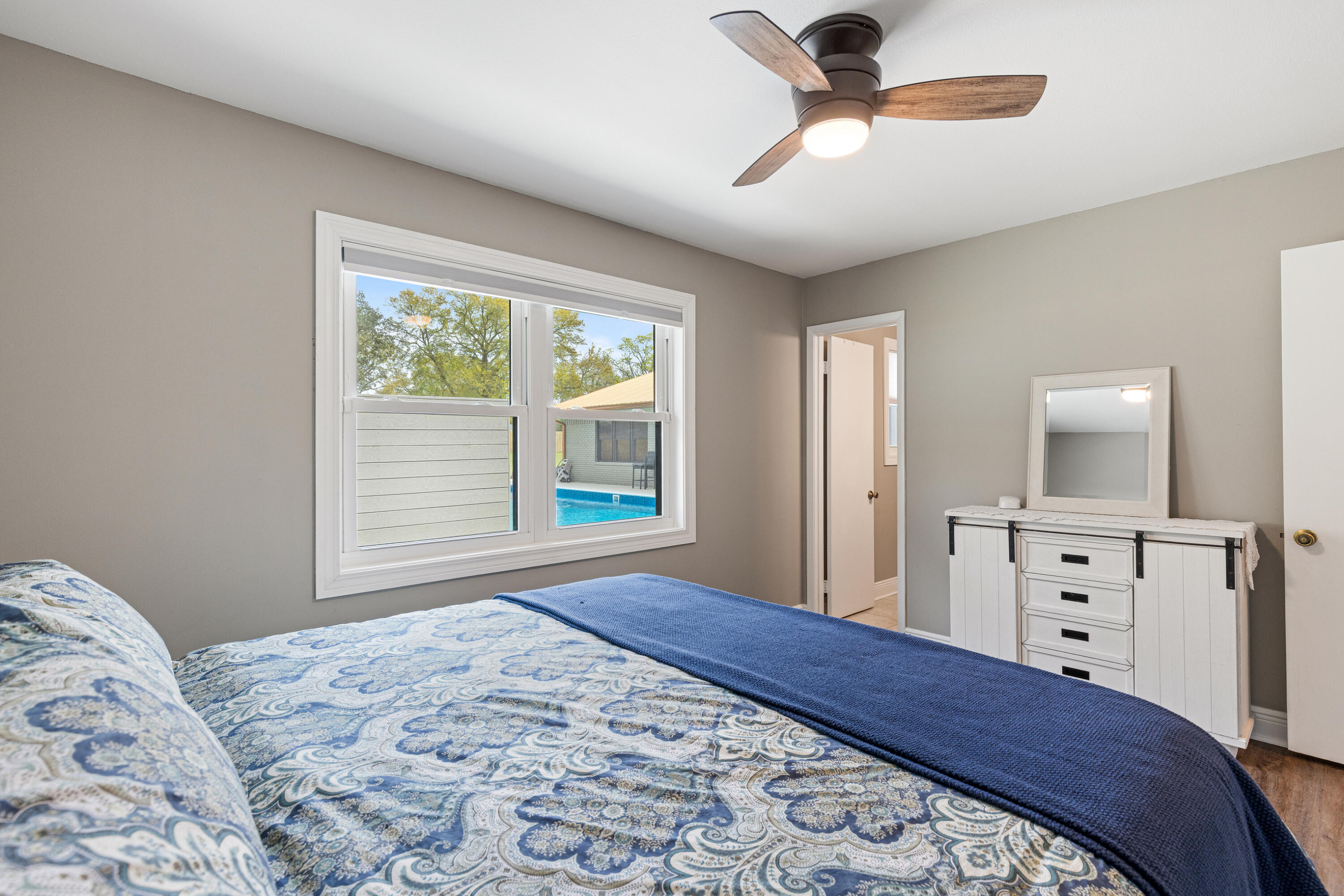804 Mars Street Destin, FL 32541 - Photo 28 of 71 a bedroom with a bed and a dresser