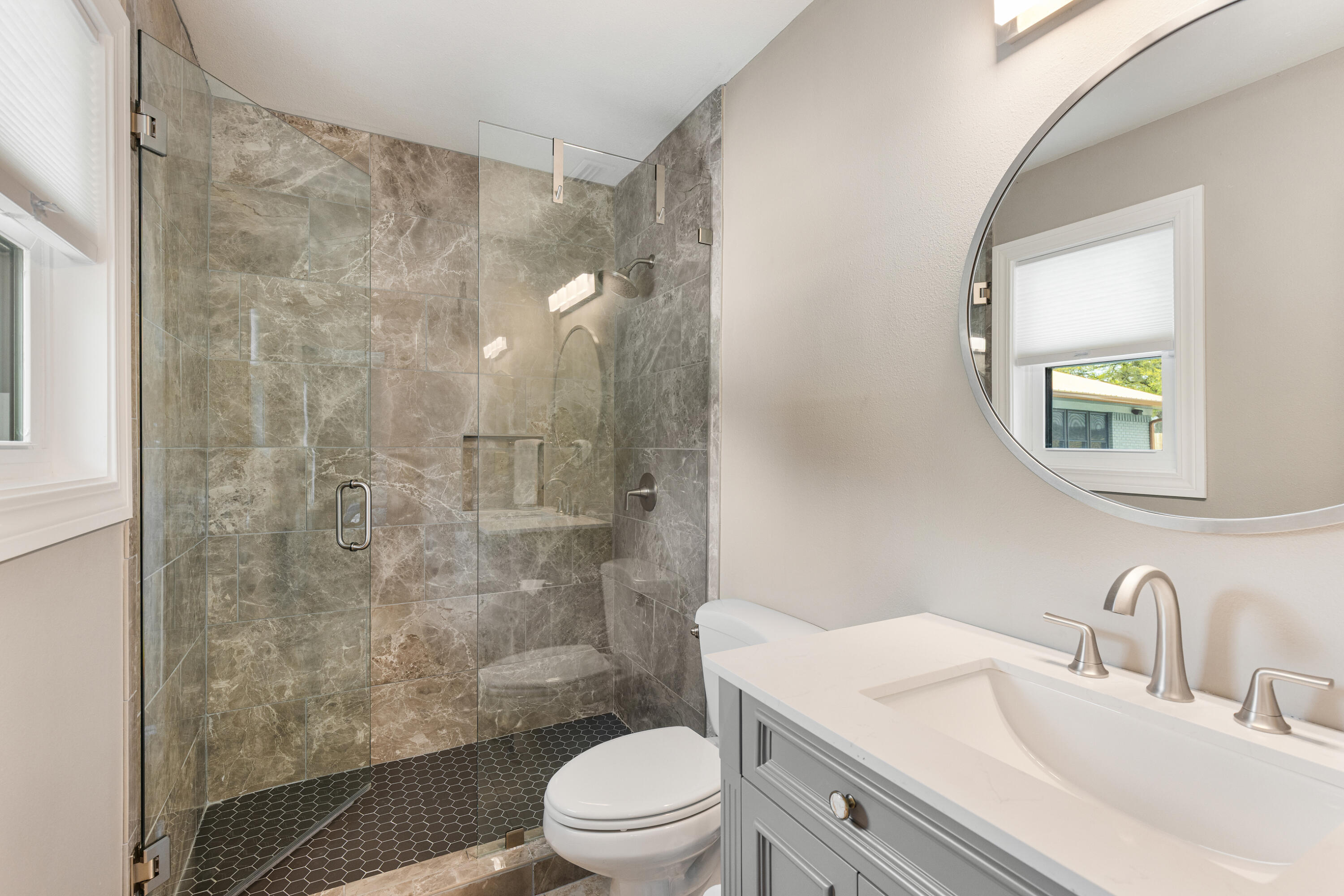804 Mars Street Destin, FL 32541 - Photo 29 of 71 a bathroom with a sink a toilet and shower